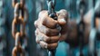 © svastix - A close-up image showing a strong hand tightly gripping a thick, sturdy chain, symbolizing strength, resilience, and the bonds that hold things together.