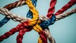 © Guddah - Colored team rope diverse strength connect partnership together