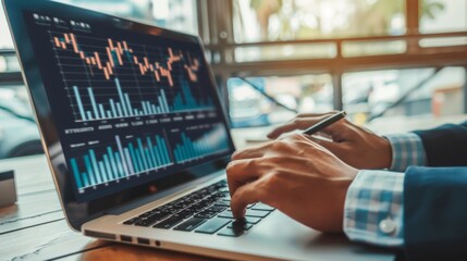 Fototapete - A businessman analyzing business growth and financial performance with graphs and charts on a laptop screen.