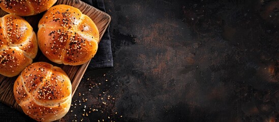Aufkleber - Dark background with a board displaying delicious garlic buns offering copy space image
