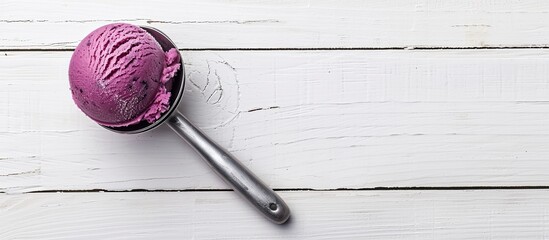 Poster - Side view of blueberry sorbet in an ice cream scoop on a white wooden surface offering empty space for image insertion. with copy space image. Place for adding text or design