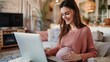 © Sirichat. Camphol - Photo of a pregnant woman using a home computer