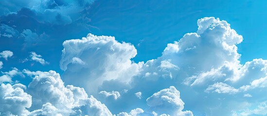 Aufkleber - A vivid blue sky with dense white clouds providing a perfect backdrop for text or images with enough room on the side for copy space image
