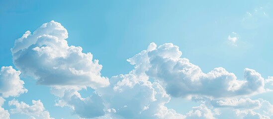 Poster - Background of a clear blue sky with fluffy white clouds perfect for copy space image