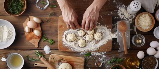 Wall Mural - Creating a dish for baking in the oven at a kitchen workstation with spices salt and herbs on a cutting board nearby offering potential copy space in the image