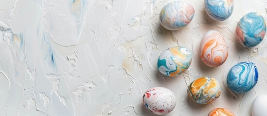 Aufkleber - Minimalistic flat lay of marbled painted eggs on a white background with copy space image