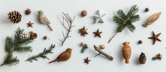 Poster - Minimalistic top down view of a festive flat lay for New Year and Christmas featuring items like fir branches stars and wooden bird figurines set against a light background with spacious copyspace im