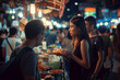 © Damian - group of friends exploring a bustling night market