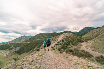 Poster - adult man and child hiking in the mountains