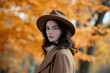 © Andrii  - Elegant Woman in Autumn Coat Amidst Golden Foliage