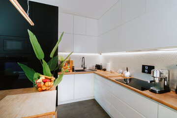 Home living room kitchen interior. Real estate white wood. Smart home display.