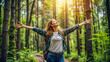 © Adisorn - Sustainable eco friendly fashion clothes woman feeling free with open arms in woods forest happy breating clean air Travel tourist girl walking in natural healthy environment renewable resource