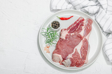 Wall Mural - Raw pork neck meat. Chop steak, red peppercorn, garlic cloves, sea salt and fresh rosemary