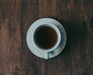 cup of coffee on wooden table