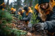 © Nena Photo - A dedicated group of volunteers planting small trees in a forest area as part of an environmental reforestation effort, showcasing teamwork and dedication to nature conservation.