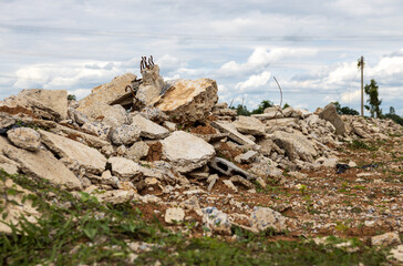 Wall Mural - A low angle view of the many concrete ruins that have been demolished.