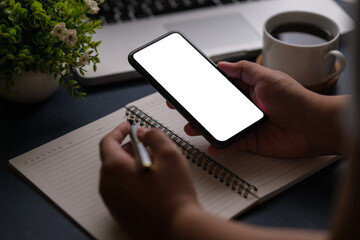 Wall Mural - Man hands holding smart phone with blank screen for your text message or information content.