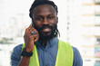 © SETO fotografias - happy african man engineer on phone talking in office.
