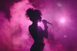 © Ольга Лукьяненко - Silhouette of a female singer performing on the Stage, holding the microphone, pink smoke, and illuminated backlit stage