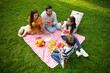 © New Africa - Happy family having picnic together in park