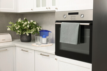 Wall Mural - Electric oven with towel in kitchen. Cooking appliance