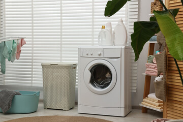 Poster - Washing machine, detergents, towels and baskets in laundry room