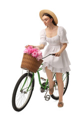 Poster - Beautiful young woman with bicycle and basket of peony flowers isolated on white