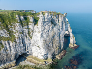 Canvas Print - Aerial view of Etretat cliffs and the Atlantic ocean. Chalk cliffs and three natural arches. Panoramic path to admire the coast. Normandy region of Northwestern France. 06-26-2024