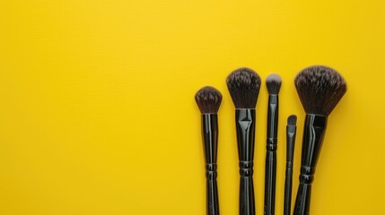 Wall Mural - Makeup artist using yellow background magenta brushes isolated on yellow background Beauty concept with space for text