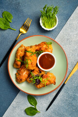 Wall Mural - Buffalo chicken wings with sweet chili sauce. Close up. Top view.