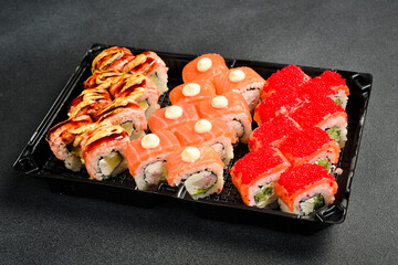 Wall Mural - A box of sushi and rolls. Japanese food. Food delivery.