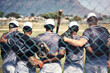 © EmilLL/peopleimages.com - Baseball, teamwork and support with back of men, together and training for game on field. Practice, solidarity and park for fitness and sport for male people, friends and group for softball and fence