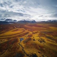 Poster - A vast, yellow and red landscape with a river running through it