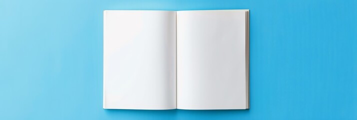 mock up of blank white open book on a blue background 