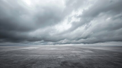 Wall Mural - Gray Sky. Dramatic Stormy Clouds on Horizon Over Dark Concrete Floor