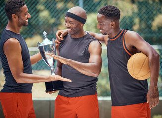 Wall Mural - Award, success and basketball athletes with a trophy as a reward or prize after winning a competitive sports game. Challenge, fitness and happy African winners in celebration after mens championship