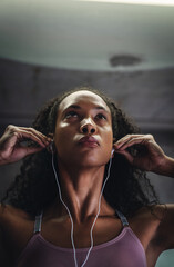 Poster - Fitness, music or face of woman in gym for commitment, determination or mindset for sport. Female athlete, earphones or serious with mockup for workout, thinking or drive from favorite song on radio