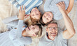 © Maass/peopleimages.com - Above, portrait and family with love, funny and tickle with happiness, smile and time together. Face, parents and mother with father, kids and fun with childhood, playful and joke with care in home