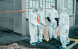 © HockleyM2/peopleimages.com - Safety, protection and group of doctors in meeting with scientists in hazmat ppe to prevent spread of virus. Virologist, medical workers or people in city for healthcare, covid or pandemic disease