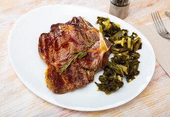 Wall Mural - Ternera con acelgas, spanish dish of grilled beef with chard