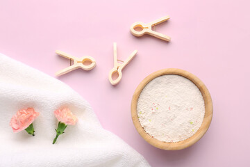 Wall Mural - Laundry detergent, clothespins and carnation flowers on pink background