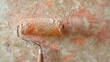 © AkuAku - Close up of copper painted roller applying paint indoors over textured wall surface Home repair with empty area for text