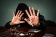 © Aria Armoko - Stop drugs concept. A man makes a stop drug gesture, Human hand stops drugs, Against Drug Abuse