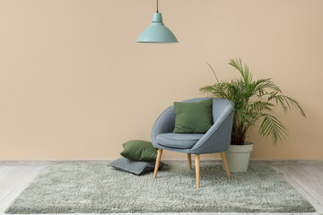 Poster - Interior of living room with green carpet, armchair and palm tree