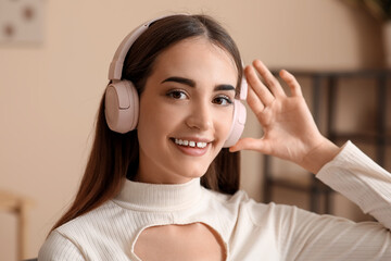 Wall Mural - Young woman in headphones with diastema at home, closeup