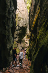 happy friends hiking walking in canyon