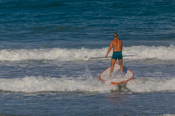 Wall Mural - surfer in a board on the waves