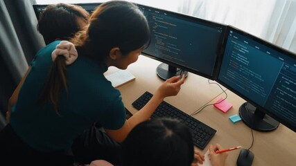 Slow motion back end software developer engineer for computer programming working together on debugging writing computing code, solving complex algorithms display on monitor in office. Burgeoning