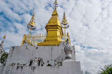 the wat chom si temple on the top of mount phousi in luang prabang, laos