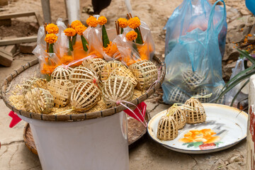 Wall Mural - Luang Prabang, Laos : offerings at the entrance of Wat Tham Phousi in the middle of mountain Mount Phousi 